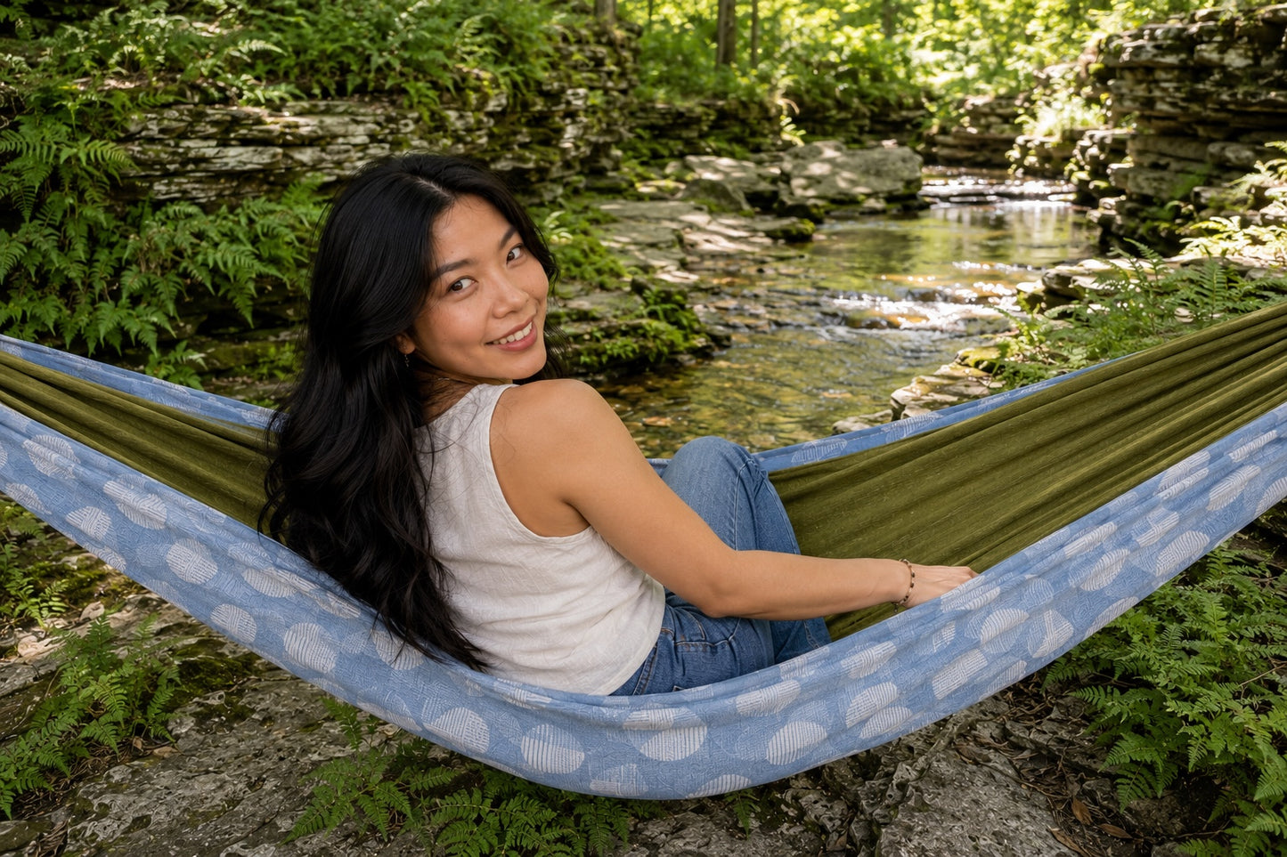 Woman looking back with a smile from Fernwater Solstice Premium Hammock