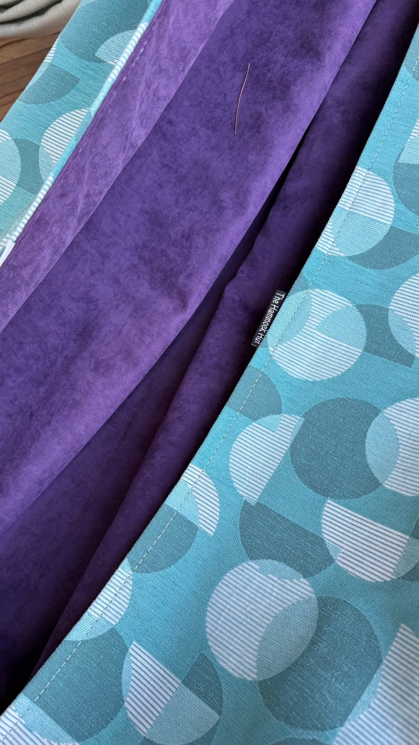 Close-up of the Azure Solstice aqua patterned exterior and rich purple velvety interior