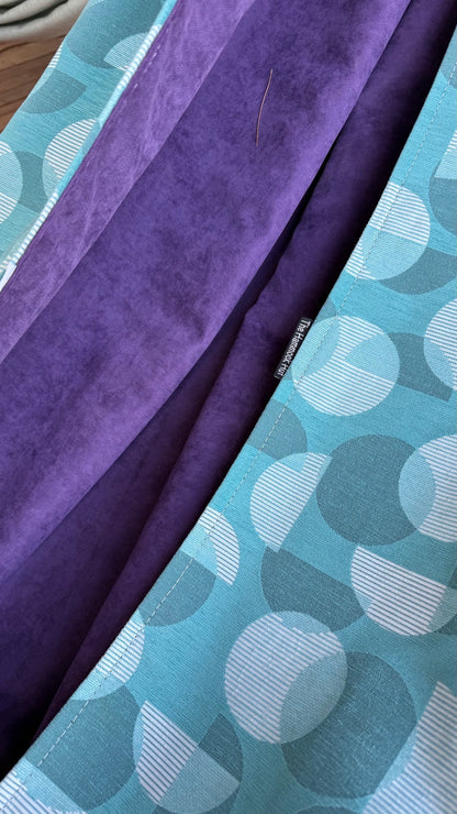 Close-up of the Azure Solstice aqua patterned exterior and rich purple velvety interior