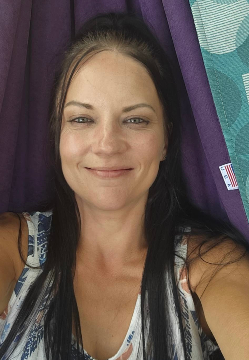 Close-up of Kathy smiling in the Azure Solstice hammock