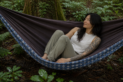 Botanica Solstice Premium Hammock in a rain-kissed cedar garden