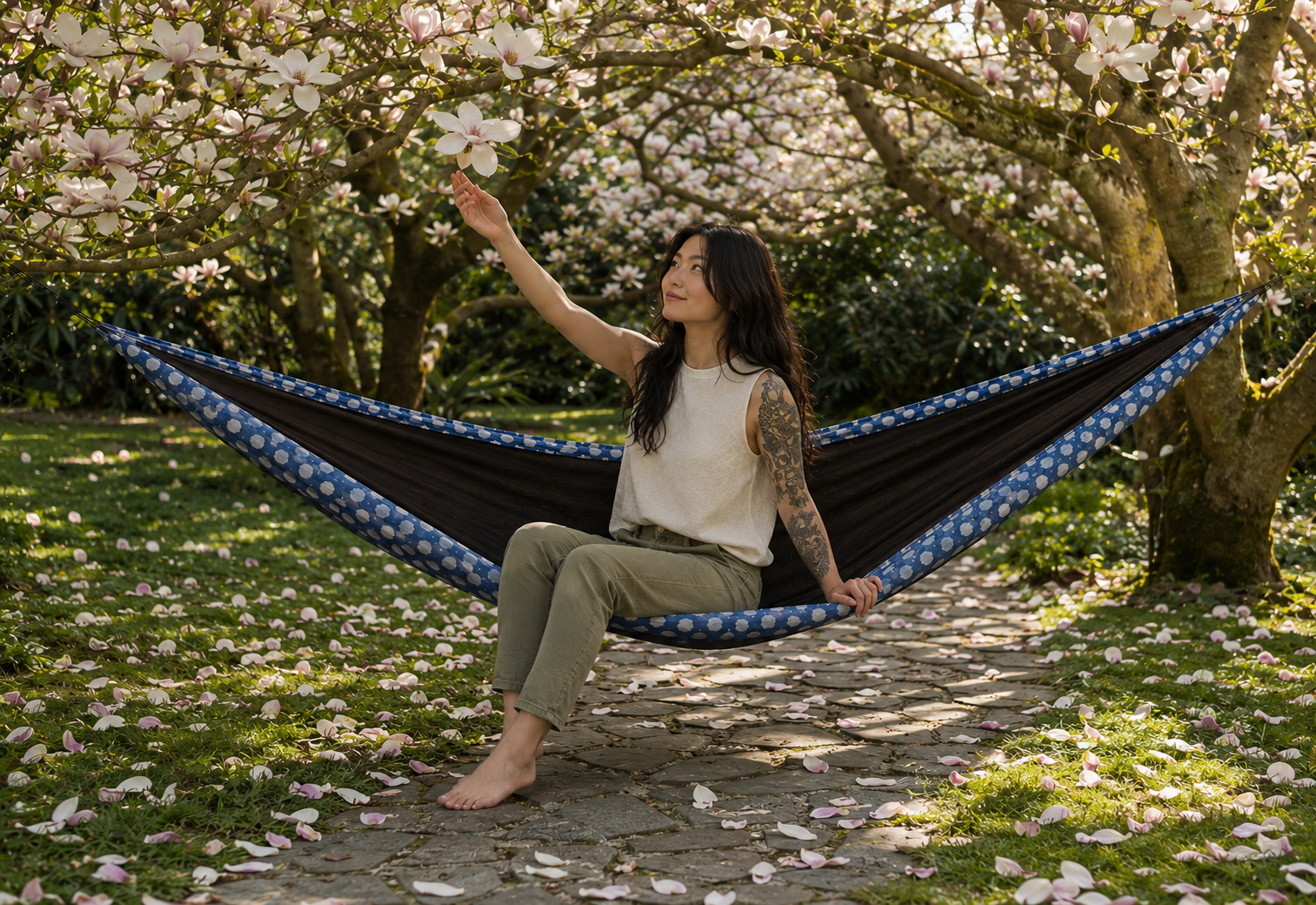 Botanica Solstice Premium Hammock beneath a canopy of blossoms