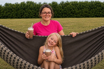 Mother and daughter enjoying chocolate milkshakes in Chocoholic Premium Hammock