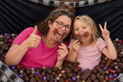 Mother and daughter smiling with chocolate in Chocoholic Premium Hammock
