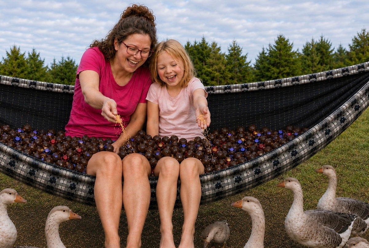 Mother and daughter sitting in Chocoholic Premium Hammock feeding geese