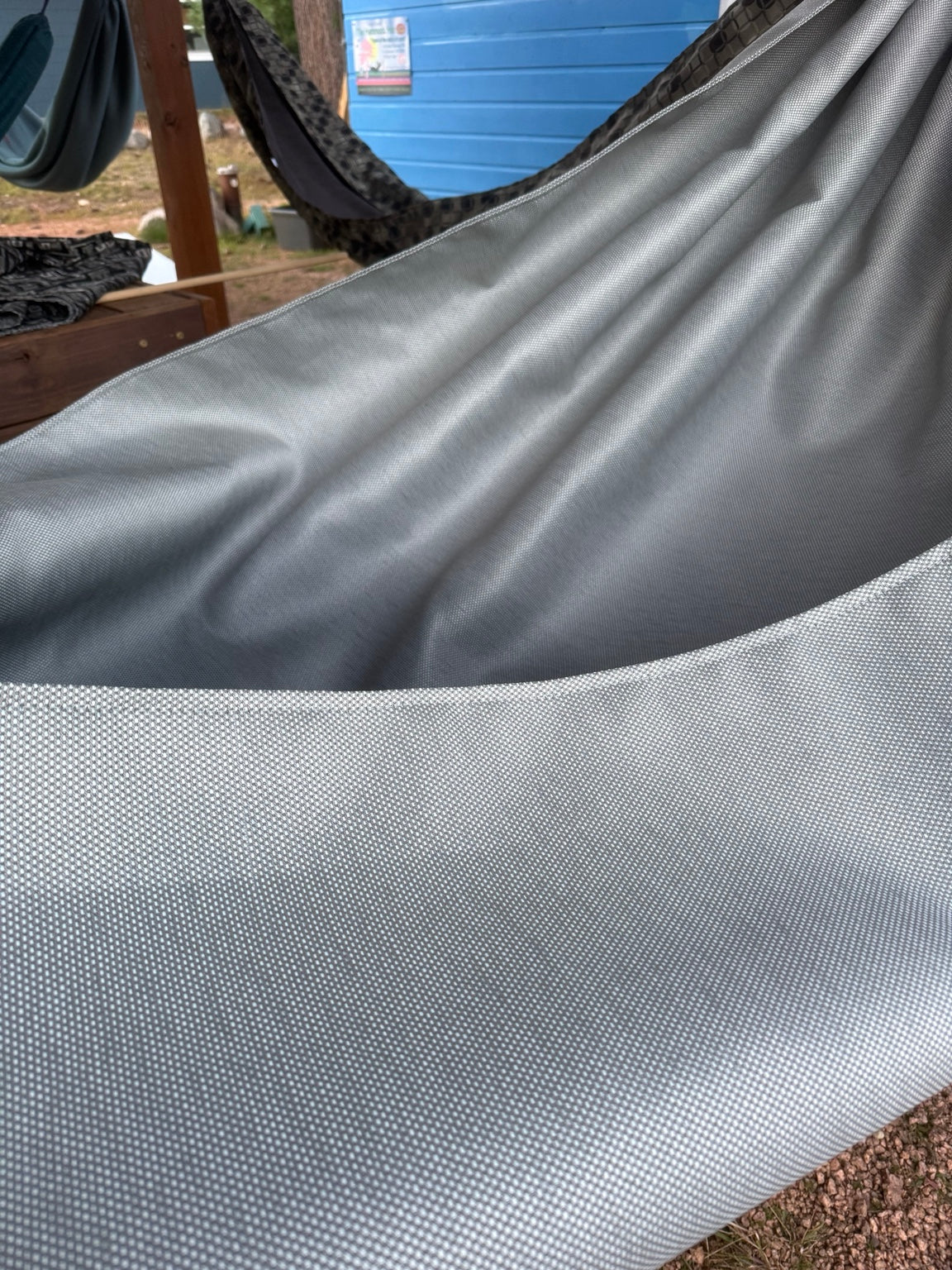 Close-up of the Concrete + Premium Hammock gray fabric with subtle shimmer