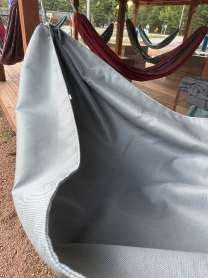 Concrete + Premium Hammock showing the extra-wide gray fabric body