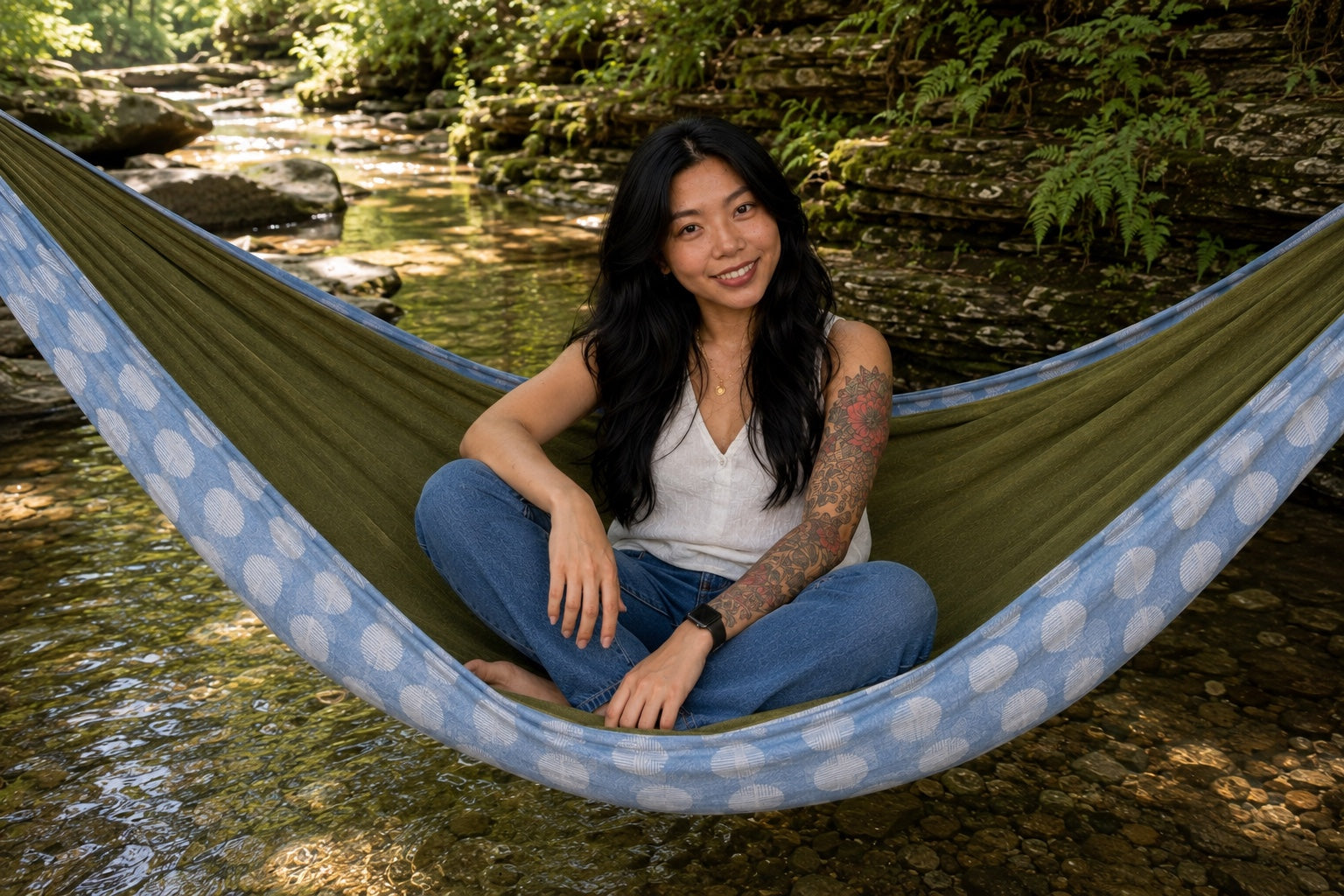 Woman sitting cross-legged in Fernwater Solstice Premium Hammock