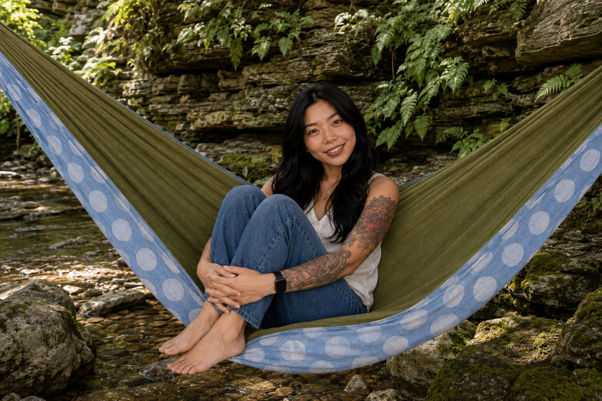 Woman sitting with her knees up in Fernwater Solstice Premium Hammock