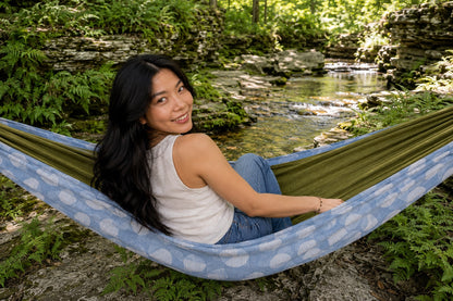 Woman looking back with a smile from Fernwater Solstice Premium Hammock