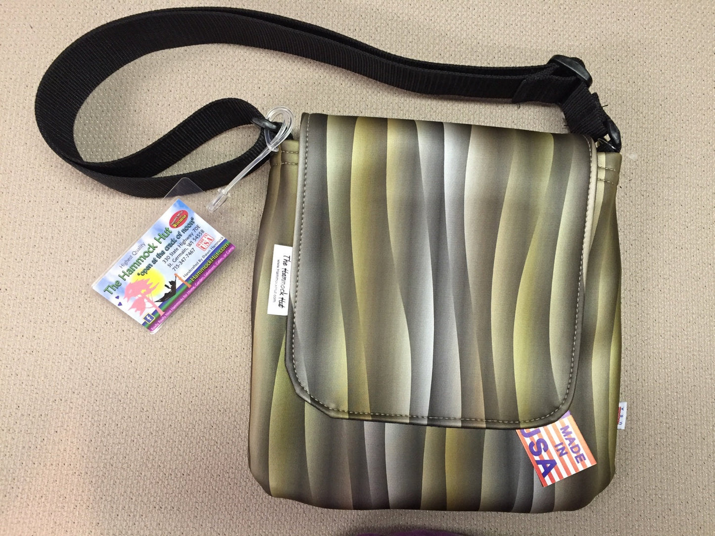 A handcrafted Hammock Hut messenger bag with a Made in USA tag.