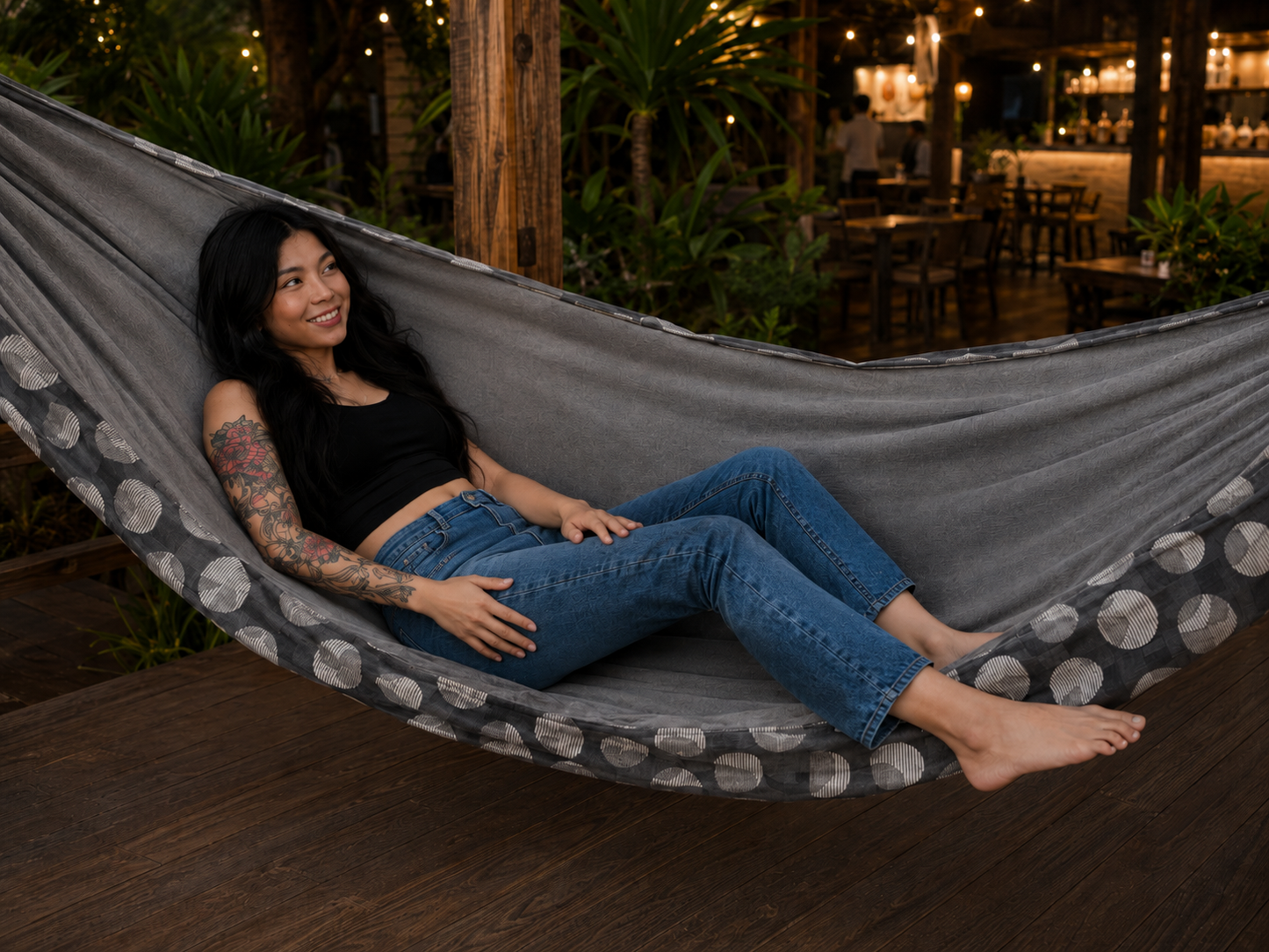 Moonstone Solstice Premium Hammock at a warmly lit garden bar