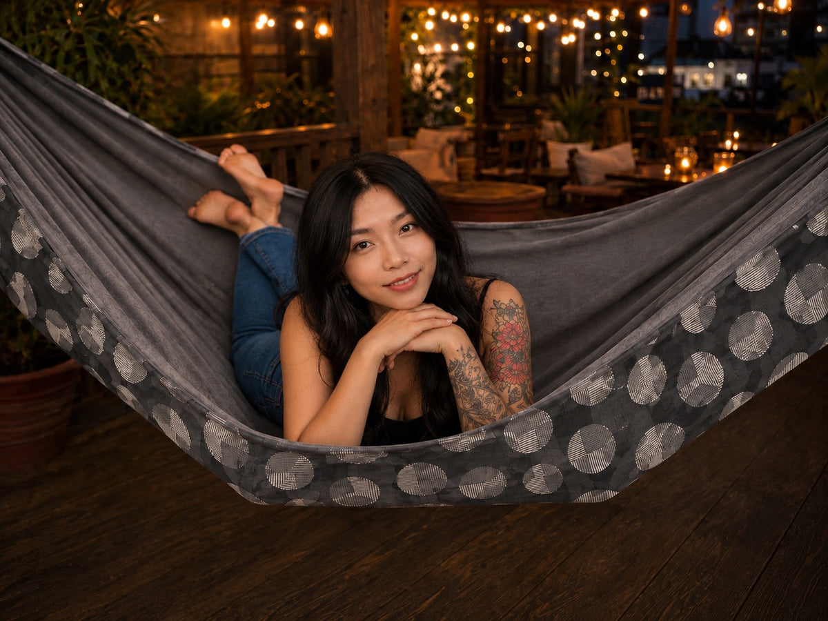 Moonstone Solstice Premium Hammock with model resting on her stomach and smiling at the camera
