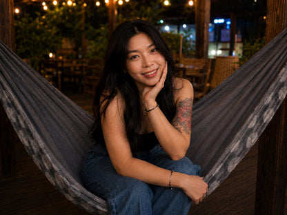 Moonstone Solstice Premium Hammock close lifestyle portrait with model resting her cheek on her hand