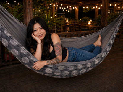 Moonstone Solstice Premium Hammock with model resting comfortably on her stomach and smiling