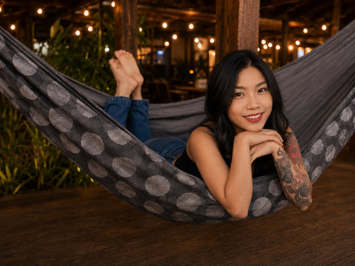 Moonstone Solstice Premium Hammock with model lying on her stomach and resting her chin on her hands