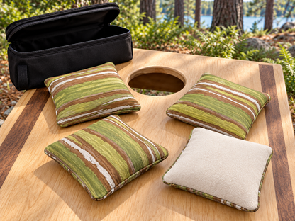 Four Premium Painted Stripe Green cornhole bags with cream Maglite reverse and black carrying case