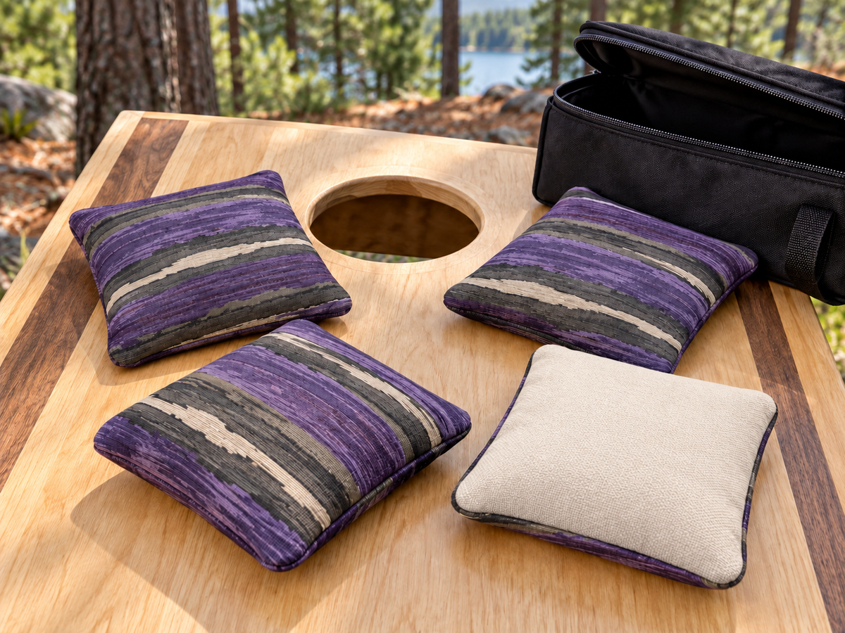 Four Premium Painted Stripe Purple cornhole bags with cream Maglite reverse and black carrying case