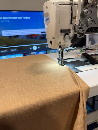 Sandbox premium hammock fabric being sewn with sand-colored thread