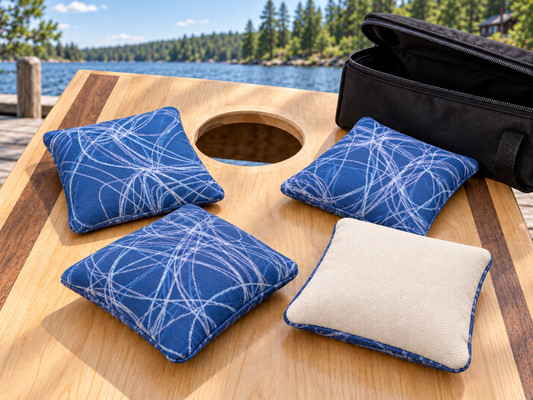 Four Premium Scribble Sapphire Blue cornhole bags with cream Maglite reverse and black carrying case