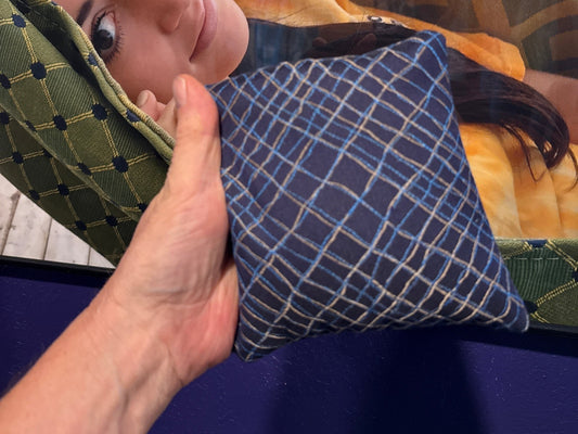 Spark Flow Midnight cornhole bag held in hand, landscape product photo