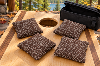 Four Spark Flow Mocha cornhole bags with matching patterned faces and black carrying case